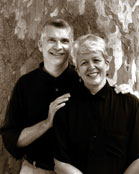 Photo of Cynthia and Phil dressed in black for a performance